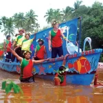A boat with locals of Goa celebrating Sao Joao festival