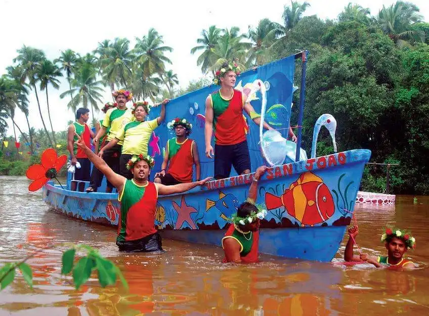 A boat with locals of Goa celebrating Sao Joao festival